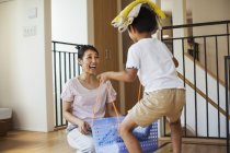 Woman and son sorting the laundry — Stock Photo