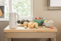 Kitchen table by window — Stock Photo
