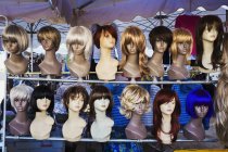 Mannequin heads and display of wigs — Stock Photo