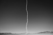 Smoke trail from rocket shooting — Stock Photo