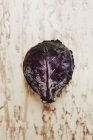 Red cabbage on wooden surface — Stock Photo