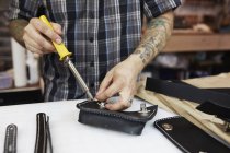 Craftsman at leather workshop — Stock Photo