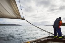 Fisherman on sailing boat — Stock Photo
