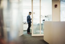 Man standing in office — Stock Photo
