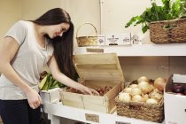 Woman choosing vegetables — Stock Photo