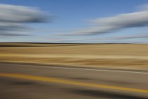 Blurred road and sky — Stock Photo