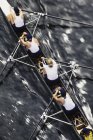 Female rowing crew in racing shell — Stock Photo