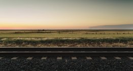 Train tracks through rural landscape — Stock Photo