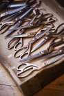 Tray of old dressmakers scissors — Stock Photo