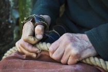 Man wearing sailmakers palms — Stock Photo