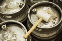 Kegs and solid hammer — Stock Photo