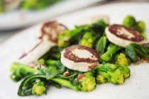 Scallops and green vegetables. — Stock Photo