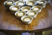 Small bowls with portions of butter — Stock Photo