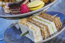 Selection of sandwiches and cakes — Stock Photo