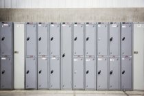 Row of grey metal lockers — Stock Photo