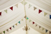 Wedding marquee decorated with bunting. — Stock Photo