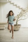 Girl running in house. — Stock Photo
