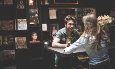 Young people sitting in bar. — Stock Photo