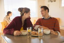 Couple sitting at table in coffee shop. — Stock Photo