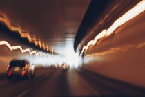 Cars driving through tunnel, long exposure. — Stock Photo