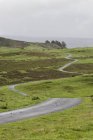 Winding road across open moorland countryside of Northumberland, England. — Stock Photo
