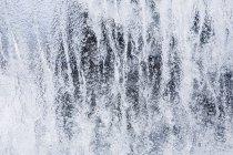 Rush of water flowing over waterfall cliff. — Stock Photo
