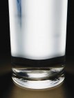 Light shining through glass of filtered water. — Stock Photo