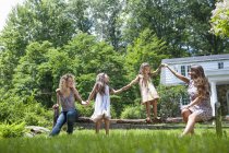 Family playing in green garden in summer. — Stock Photo