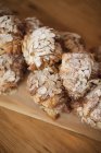 Fresh baked almond croissants with sugar icing. — Stock Photo