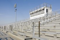 Railings and bleachers at high school stadium — Stock Photo