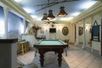 Billiards table in leisure lounge interior — Stock Photo