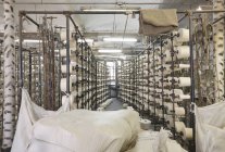Spools in textile factory interior, Nikologory, Russia — Stock Photo