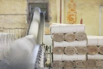 Canvas rolls on factory conveyor, Nikologory, Russia — Stock Photo