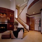 Living room and stairway in upscale house — Stock Photo