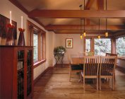 Large hardwood dining room in country house — Stock Photo