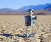 Toy robot in desert of Death valley in California, USA — Stock Photo