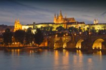 Scenery of old world cityscape of Prague illuminated at dusk, Czech Republic, Europe — Stock Photo