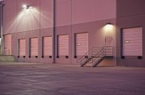 Closed doors of warehouse loading dock at dusk, Phoenix, Arizona, USA — Stock Photo