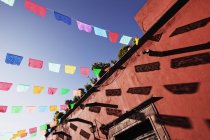 Multicolor banners against blue sky, San Miguel de Allende, Guanajuato, Mexico — Stock Photo