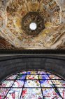 Ceiling and stained glass window in Brunelleschi Dome, Florence, Italy, Europe — Stock Photo