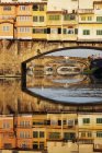 Ponte Vecchio crossing river Arno in Florence, Italy, Europe — Stock Photo