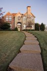 Pathway to large home on hillside in McKinney, Texas, USA — Stock Photo