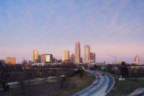 Charlotte skyline at sunrise and skyscrapers in downtown of city, USA — Stock Photo
