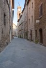 Medieval street and clock tower, Pienza, Italy — Stock Photo