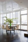 Dining room in luxury highrise apartment — Stock Photo