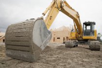 Bulldozer breaking ground at construction site — Stock Photo