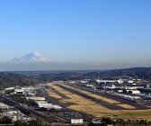 Airport with mountains in distance in Seattle, Washington, USA — Stock Photo