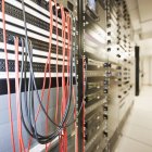 Close-up of computer servers and cords in server room in Seattle, Washington, USA — Stock Photo