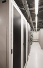 Computer servers in industrial server room interior — Stock Photo
