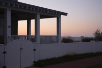 Covered porch and fence at sunset, Norfolk, Virginia, USA — Stock Photo